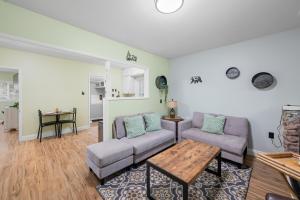 a living room with two couches and a table at Jade Bear Retreat in Big Bear City