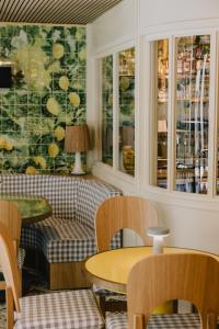 a living room with a table and a couch at Wilde Porto, Clerigos in Porto +80 photos