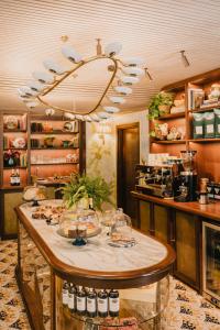 a restaurant with a table with wine glasses on it at Wilde Porto, Clerigos in Porto