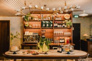 a restaurant with a table with food on it at Wilde Porto, Clerigos in Porto