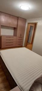 a large bed in a room with at Baltas beržas in Anykščiai +3 photos