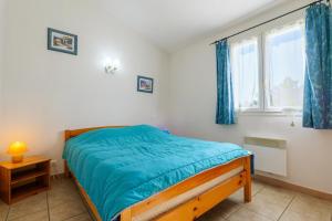 a small bedroom with a bed and a window at Le Cade - La Fontinelle in Bessas +27 photos