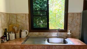 a kitchen sink with a window above it at Zen Trinity House in Ko Phangan +27 photos