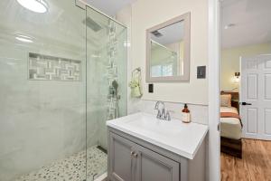 a bathroom with a sink and a shower at Jade Bear Retreat in Big Bear City +5 photos