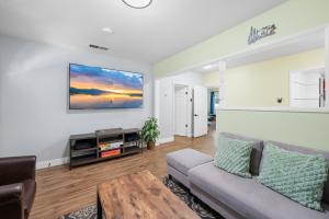 a living room with a couch and a table at Jade Bear Retreat in Big Bear City