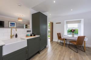 a kitchen with a sink and a counter top at The Hideaway Experience in Dundee