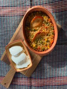 a bowl of soup and a bowl of rice on a table at DAH BOROVA - BANJA TOPILO in Banja Topilo +56 photos