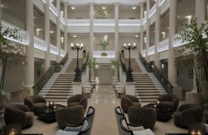 a view of the lobby of a building with stairs at Badischer Hof Baden-Baden - Leonardo Limited Edition in Baden-Baden