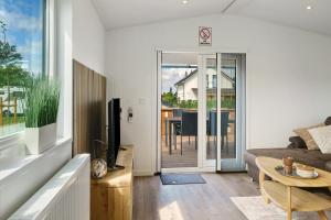 a living room with a couch and a table at Rotkäppchen in Dörverden