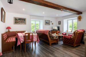 a living room with chairs and a table at Gite Les Jonquilles in Mittlach