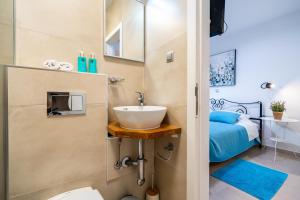 a small bathroom with a sink and a bed at Hvar Villa Maris in Hvar +62 photos