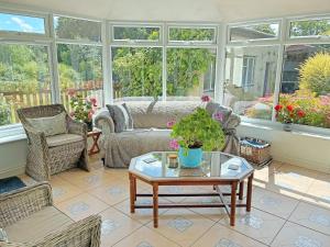 a living room with a couch and a table at Oak Tree Cottage - E5062 in Birley