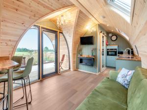 a living room with a couch and a table at The Warren - Uk47582 in Sutton on the Hill
