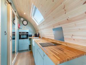 a kitchen with a wooden counter top and a window at The Warren - Uk47582 in Sutton on the Hill +6 photos