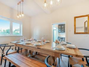 a dining room with a wooden table and chairs at The Old Doctors Manor House in Whitstable