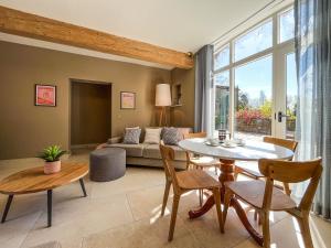 a living room with a table and chairs and a couch at Coach House - Uk51830 in Great Ayton