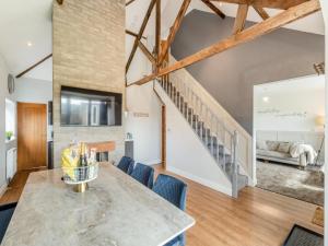 a kitchen and living room with a table and chairs at Vallum Villa - Uk40231 in Bardon Mill