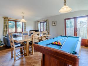 a room with a pool table and a dining room at The Lodge - Uk13202 in Cayton