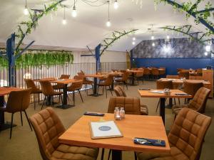 a dining room with wooden tables and chairs at The Lodge - Uk13202 in Cayton