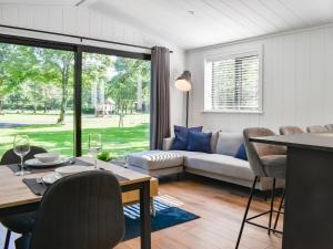 a living room with a table and a couch at Willow Lodge in Ingleton