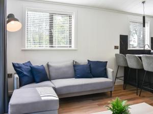 a living room with a couch and a table at Willow Lodge in Ingleton