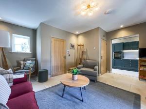 a living room with a couch and a table at Stables - Uk51829 in Great Ayton