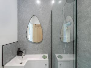 a bathroom with a sink and a mirror at Trig View - Uk49915 in Bardon Mill