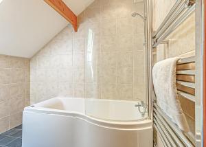 a bathroom with a tub and a shower at Tilford Woods Lodge Retreat in Hurley +71 photos