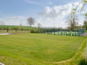 a large grassy field with a soccer field at Grieve's Cottage - Uk11107 in Montrose