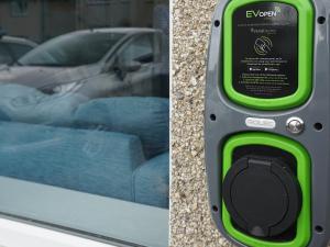 a close up of a parking meter with a car in the background at Llywnfor in Morfa Nefyn +39 photos