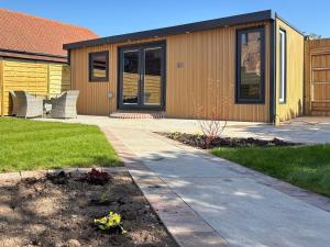 a house with a walkway in front of it at Ashtree Hideaway in Brandon