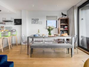 a dining room with a table and chairs at Willowmere in Dorchester