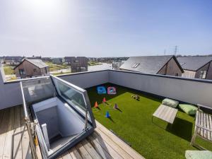 a balcony with a play area on a roof at Willowmere in Dorchester