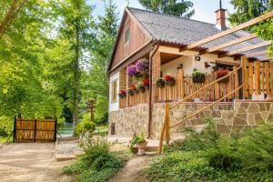 a house with flower boxes on the side of it at Cityside Cottage in Eger