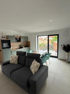 a living room with a couch and a table at Ferienwelt Wittenberge in Wittenberge