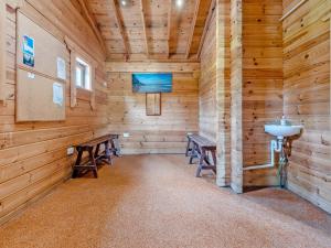 a room with benches in a log cabin at Granary - Uk49910 in Blandford Forum +35 photos