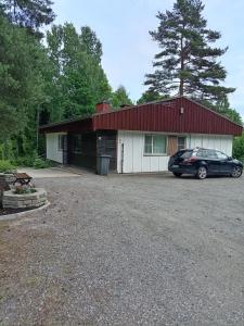 a car parked in front of a building at Apartment by the park in Imatra