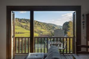 a room with a large sliding glass door with a view at CAN ROC in Camprodon