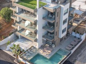 an aerial view of a building with a swimming pool at Solianna Rethymno Suites in Rethymno +74 photos
