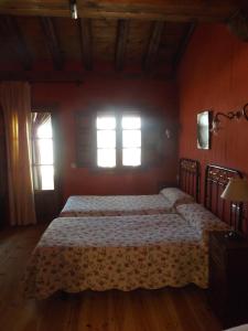 A bed or beds in a room at La Fragua de los Alvaro