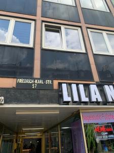 a store front of a building with a sign on it at Unterkunft Mara in Oberhausen