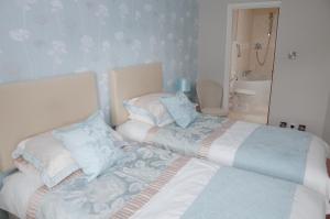 Postel nebo postele na pokoji v ubytování Sophie's B&B