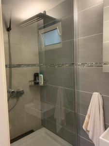 a bathroom with a shower with a glass door at Unterkunft Mara in Oberhausen +22 photos