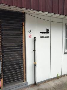 a white building with numbers on the side of it at Apartment by the park in Imatra