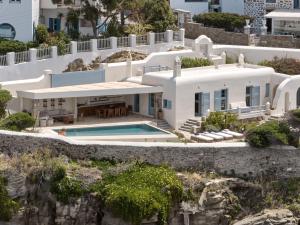 an aerial view of a house with a swimming pool at Belvedere Mykonos - Main Hotel - The Leading Hotels of the World in Mikonos