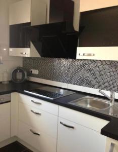 a kitchen with a sink and a counter top at Unterkunft Mara in Oberhausen