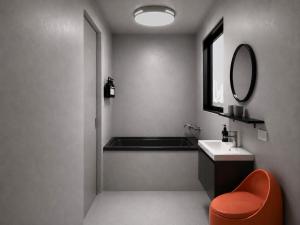 a bathroom with a tub and a sink and a mirror at 礁溪希沐湯泉民宿 2026年7月全新面貌登場 價格優惠中 in Jiaoxi