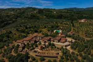 an aerial view of a house on a hill at Chapter Chianti, a Member of Design Hotels in Cavriglia
