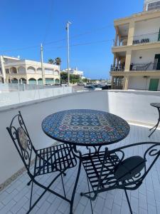 a table and chairs sitting on a patio at Riad Gilda in Torre Canne