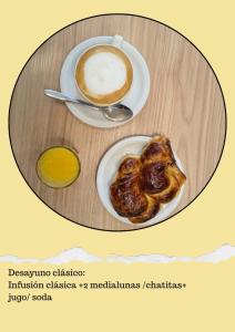 a table with a plate of food and a cup of coffee at PM departamentos in San Rafael +1 photo